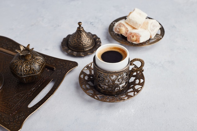 Free photo turkish coffee set served with lokum in metallic platter.