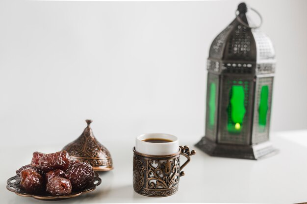 Turkish coffee with sweets and candle holder