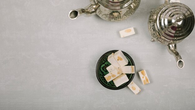 Turkish delight with teapots on table 