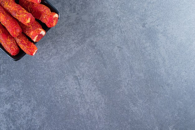 Turkish delights on a bowl , on the marble background