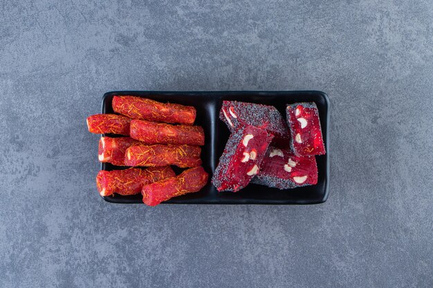 Turkish delights on a bowl on the marble surface