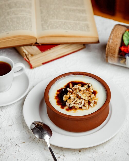 Turkish dessert firin sutlac with cup of coffee