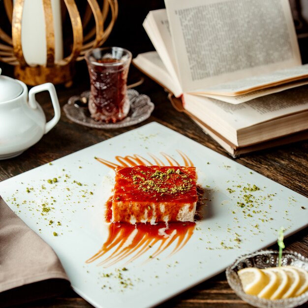 Turkish dessert trileche with caramel sauce