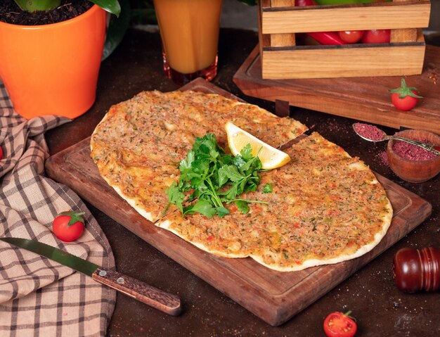 Turkish dishes: lahmacun, turkish pizzas, lemon, parsley 