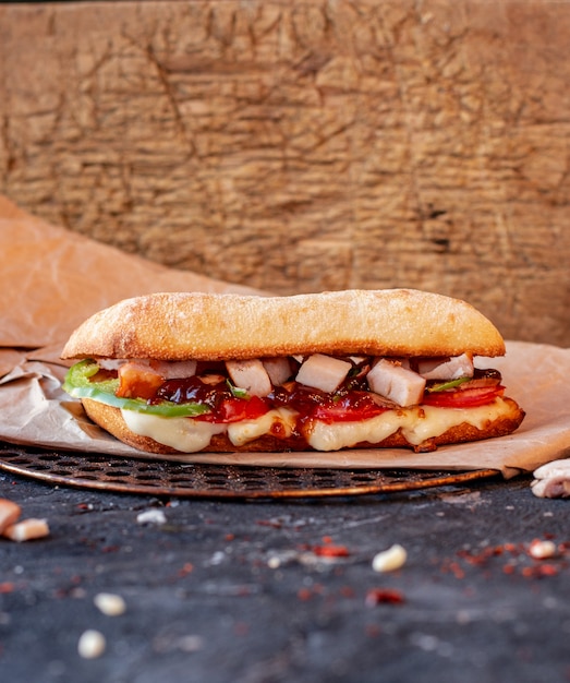 Free photo turkish iskender doner with mixed foods and melted cheese on a tablecloth