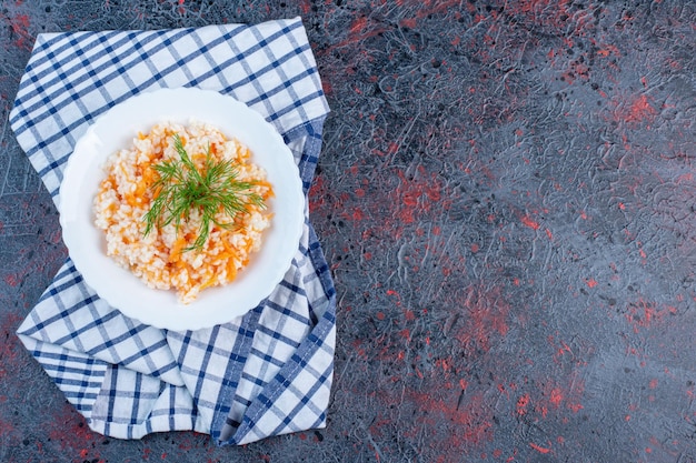 Free photo turkish menemen in a white plate with herbs.
