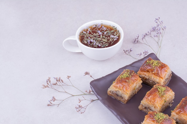 Turkish pakhlava with a cup of herbal tea