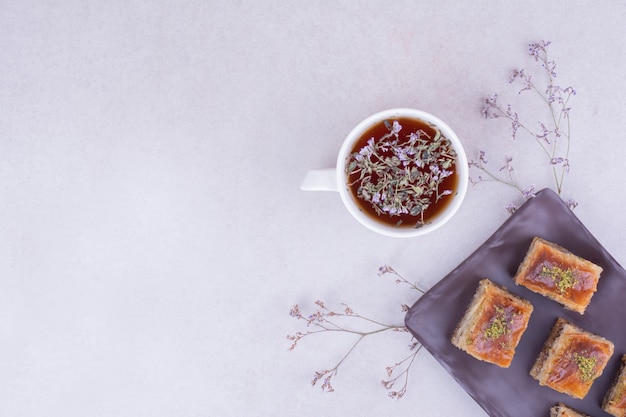 Turkish pakhlava with a cup of herbal tea