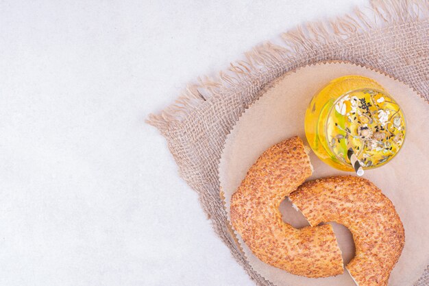 Turkish simit in a platter with a glass of lemonade.