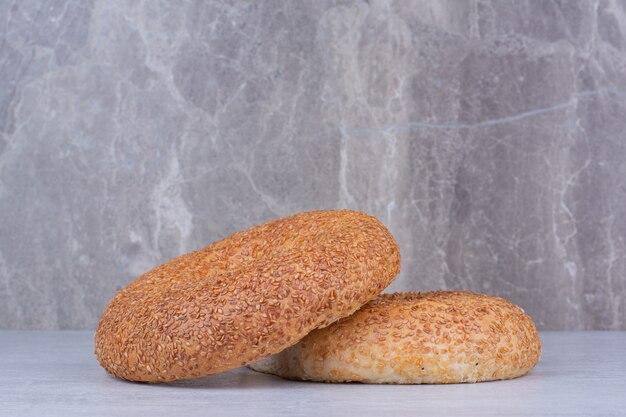 Free photo turkish simits with sesame seeds on marble table.