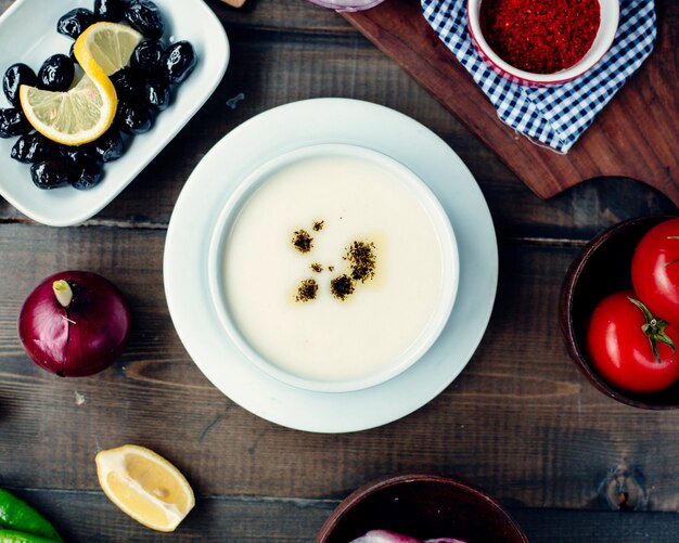 Turkish soup with ingredients on the table