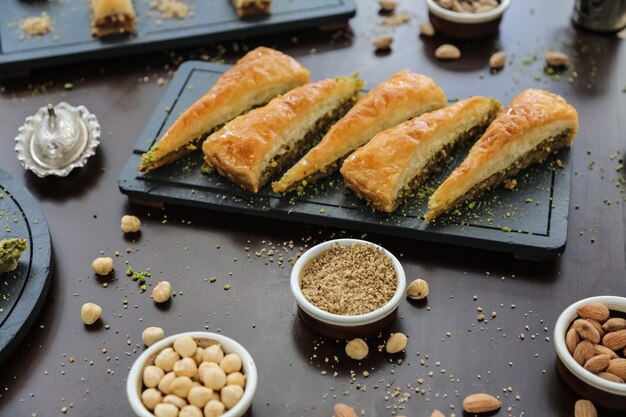 Turkish style dessert havudj dilimi walnuts pistachios syrop dough side view