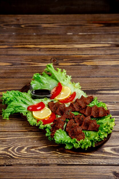 Turkish traditional _ÃÂ§iy kÃÂ¶fte_ with tomato and hot pepper