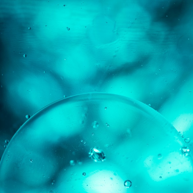 Turquoise airy bubbles and glowing drops 