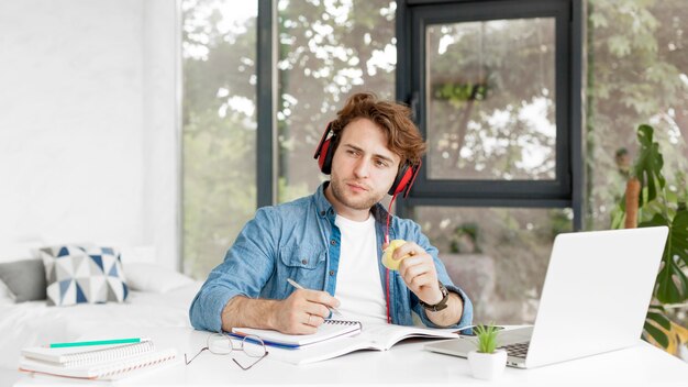 Tutor at home eating an apple