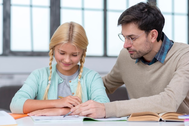 Tutor teach the young student