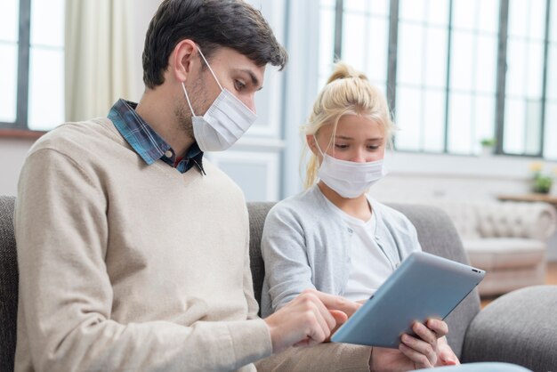 Tutor and young student looking at a tablet