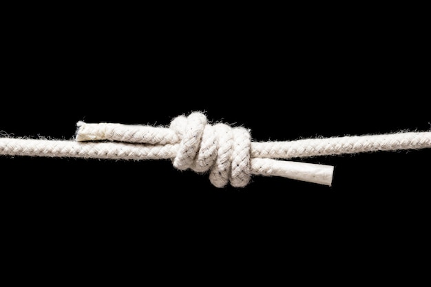 Twine strong white rope isolated on black background