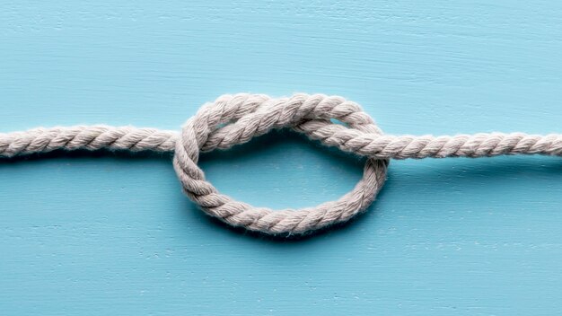 Twine strong white rope with knot flat lay