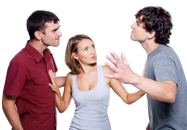 Two agressive men fight for the woman isolated on white