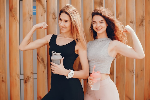 Two athletic girls have a rest