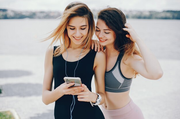 Two athletic girls have a rest