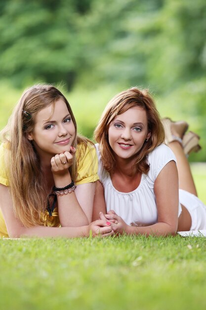 Two beautiful girls hanging in the park