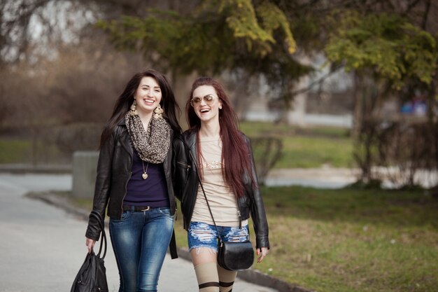 Two beautiful teenage students walking together