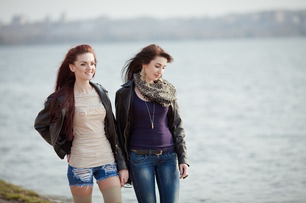 Two beautiful teenage students walking together