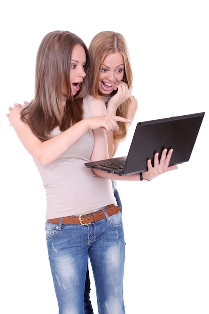 Free photo two beautiful women with laptop