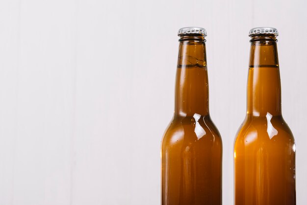 Two beer bottles on white background