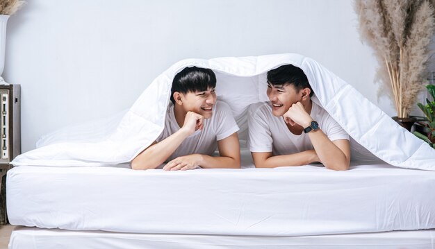 Two beloved young men slept in bed together.