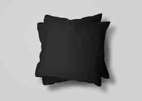 Бесплатное фото Две черные подушки на белой поверхности
