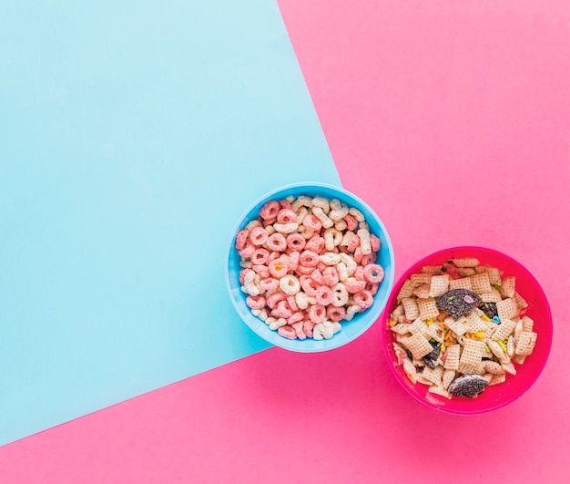 Two bowls with cereals on table 