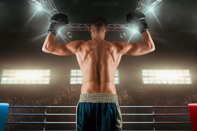 Two boxers are fighting on professional boxing ring