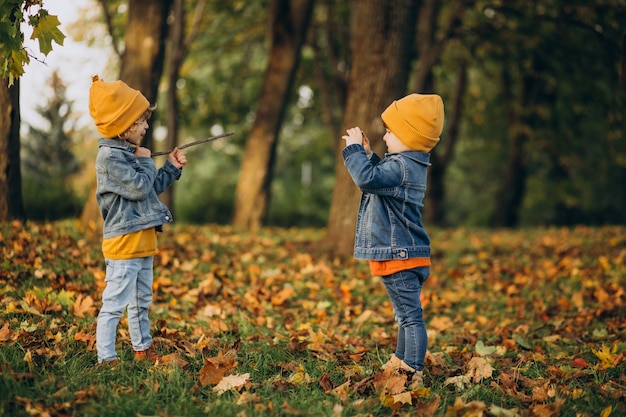 Two boys brothers having fun in park