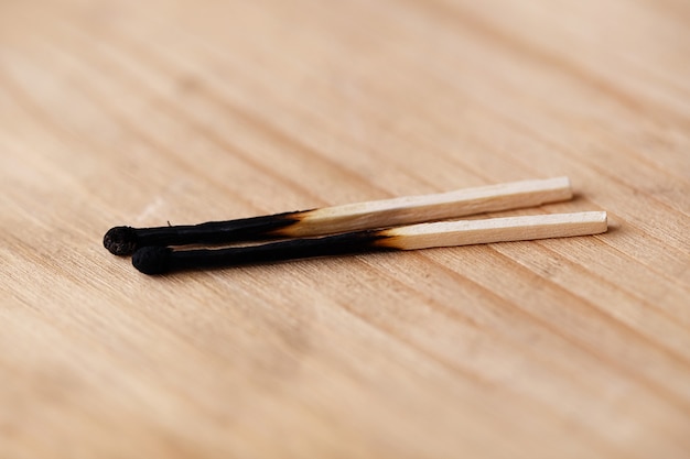 Free photo two burnt matchsticks