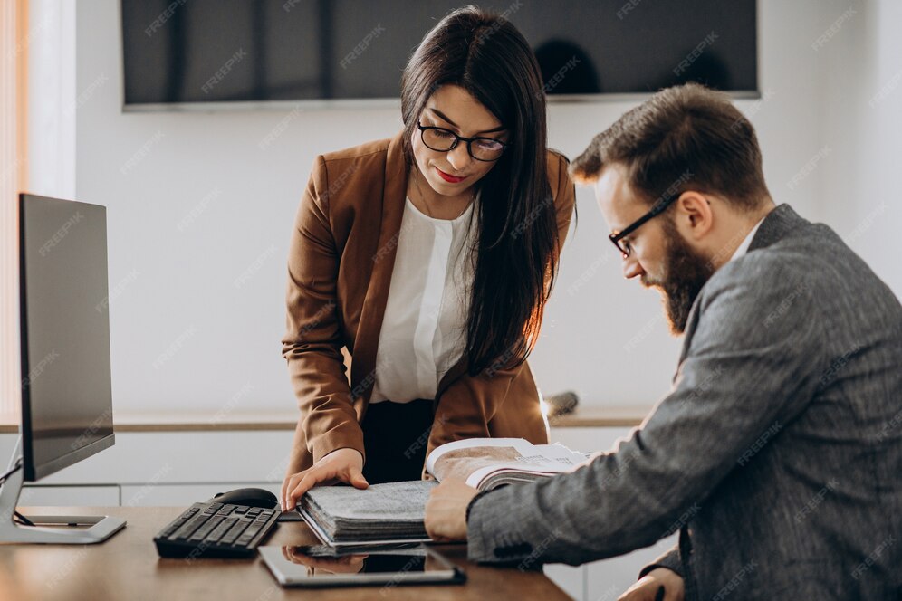 Two people reviewing documents