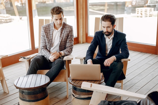 Two businessmen working at the office