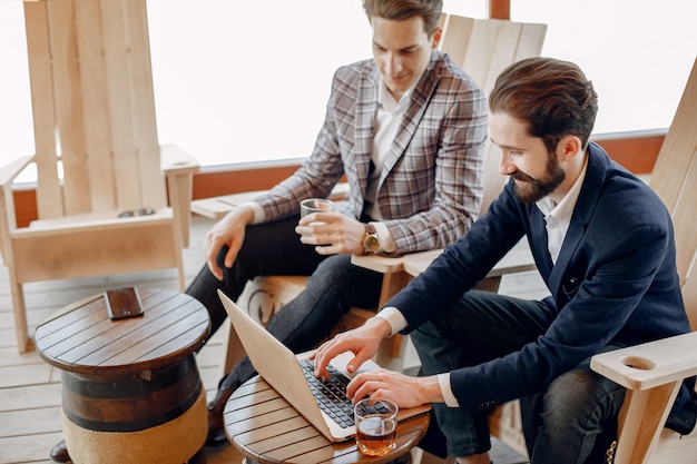 Two businessmen working at the office