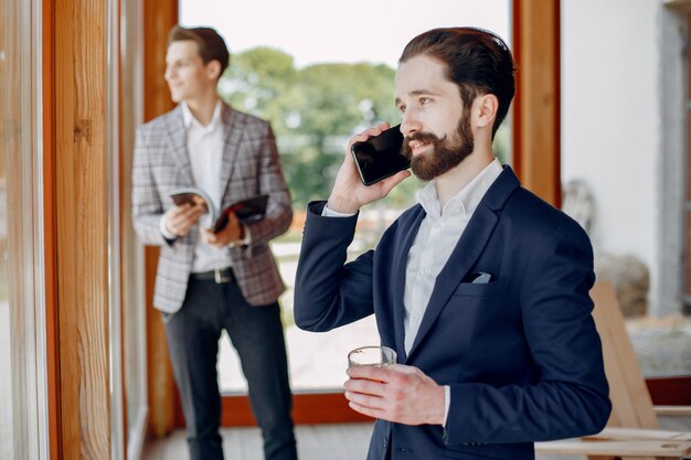 Two businessmen working at the office