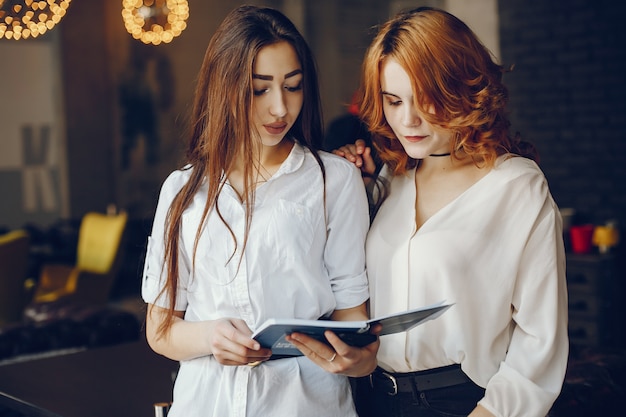 two businesswomen in a cafe