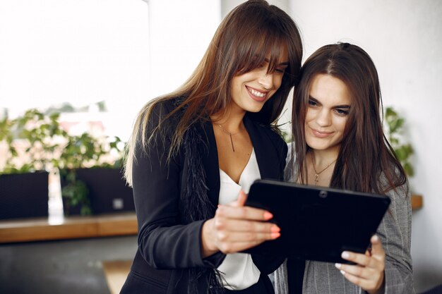 Two businesswomen working in a cafe