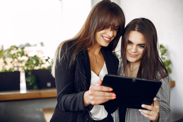 Two businesswomen working in a cafe