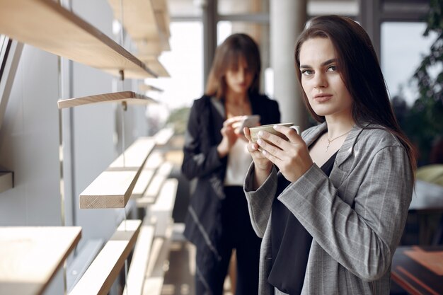 Two businesswomen working in a cafe