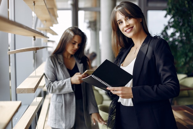 Two businesswomen working in a cafe