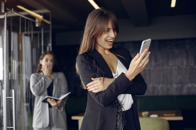 Two businesswomen working in a cafe