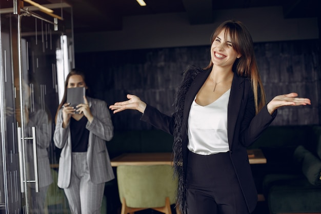 Two businesswomen working in a cafe