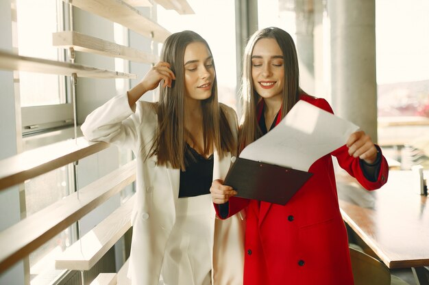 Two businesswomen working in a cafe