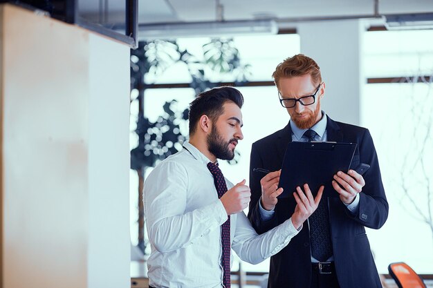 Two colleagues discuss a work plan on the eve of a business meeting.